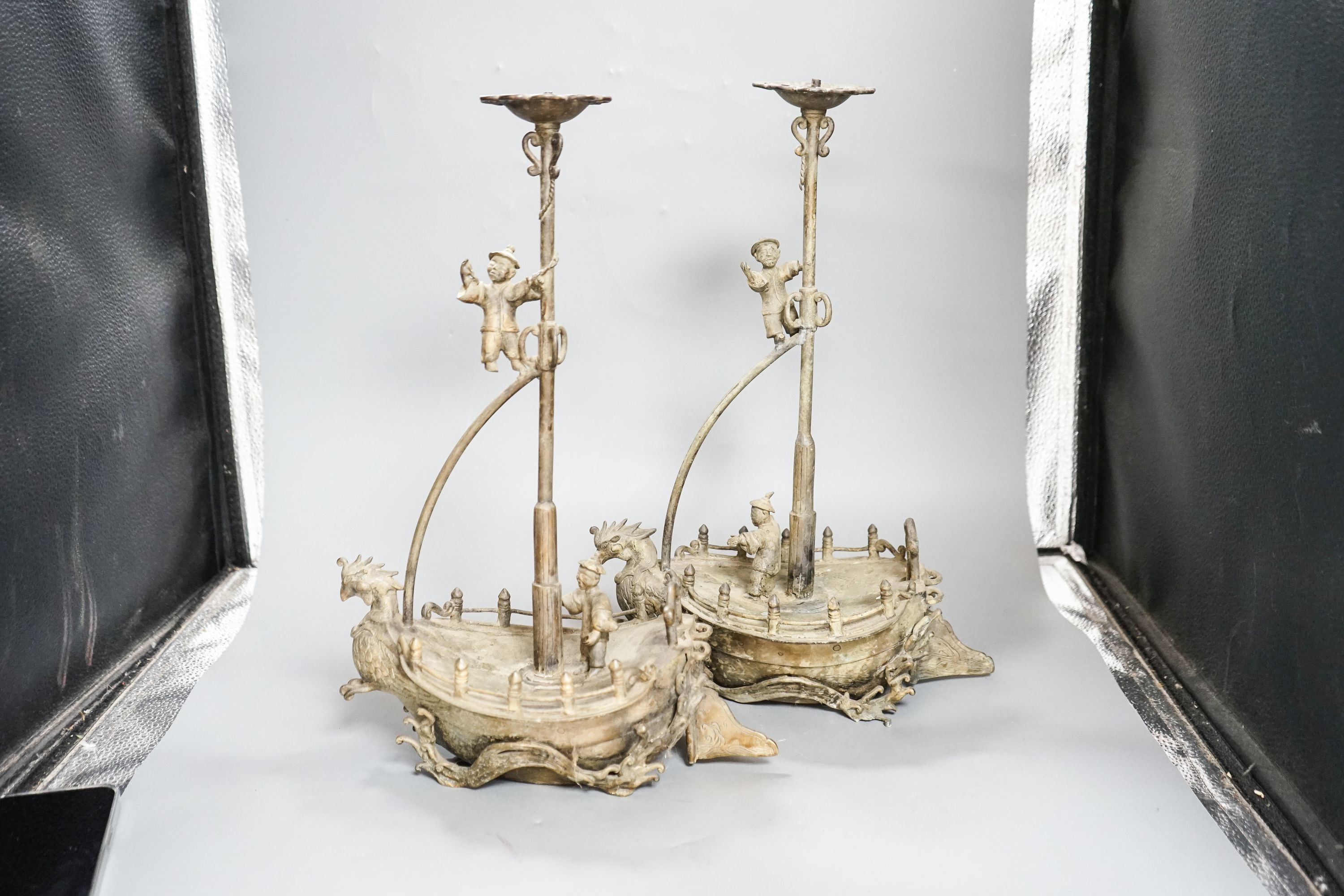 A pair of Chinese brass ‘ship’ lamp stands, 41cm